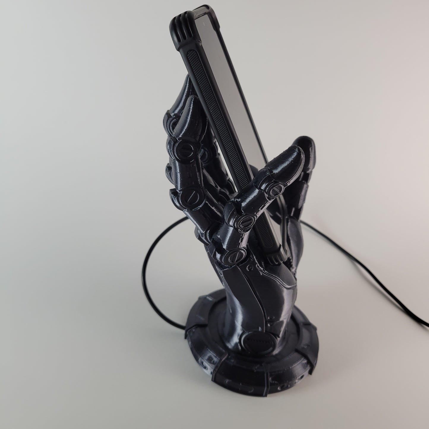 Robot Hand Phone Holder with Hidden Charging port.