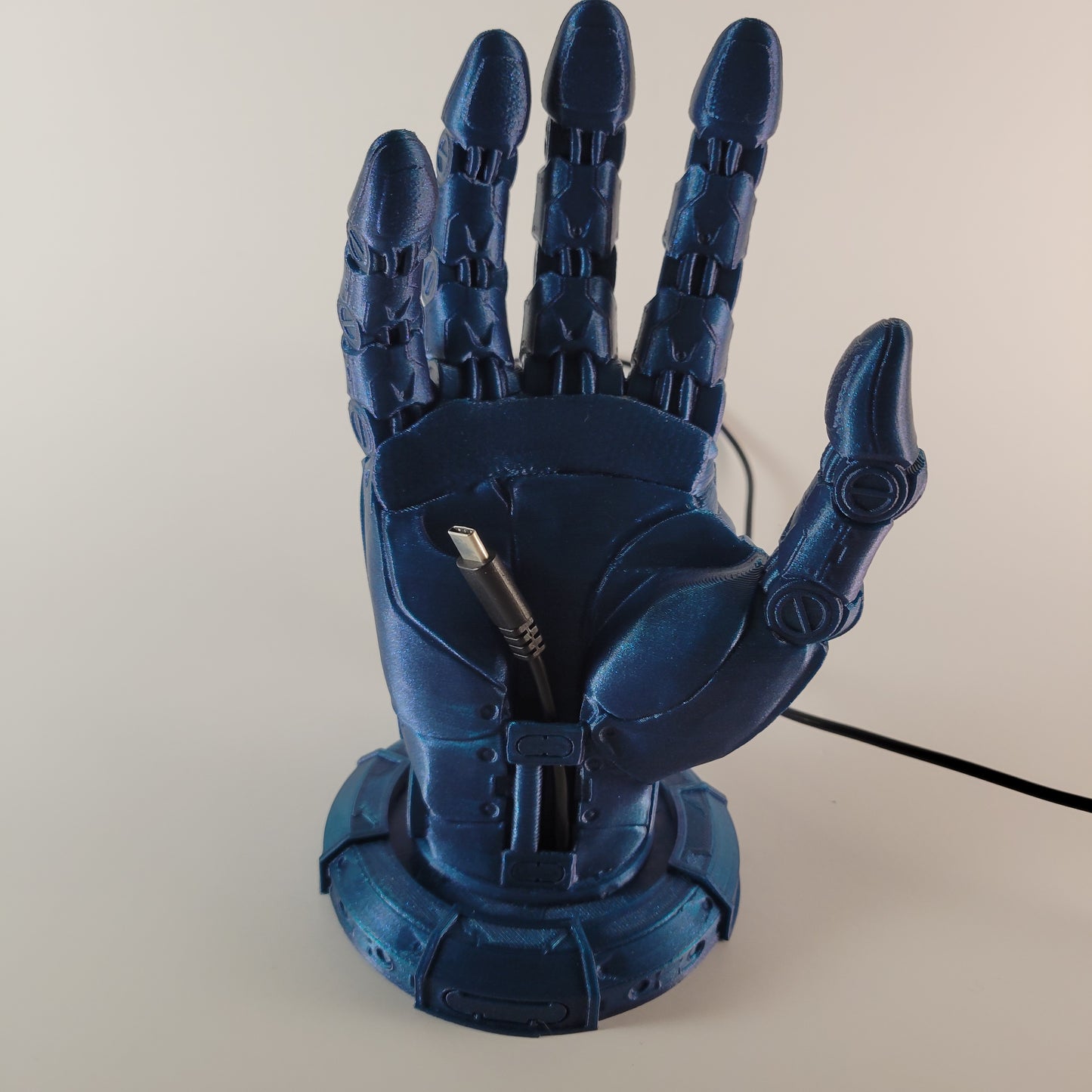 Robot Hand Phone Holder with Hidden Charging port.